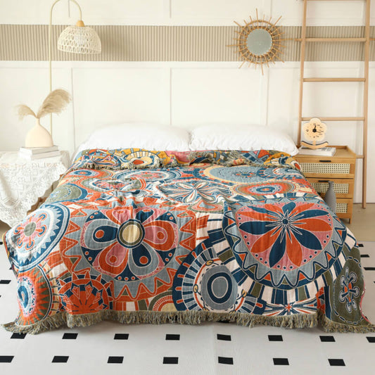 Boho geometric cotton throw blanket with retro circle pattern styled on a bed