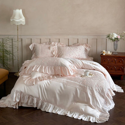Pink Butterfly Embroidered Bedding Set with dramatic ruffles on all edges in an elegant setting.