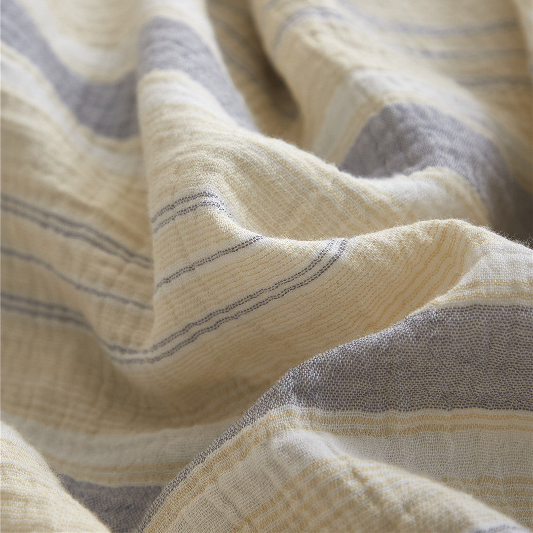Detailed fabric close-up of the Grey & Beige cotton gauze, showing the yellow, gray, and cream woven stripes and the soft crinkle texture.
