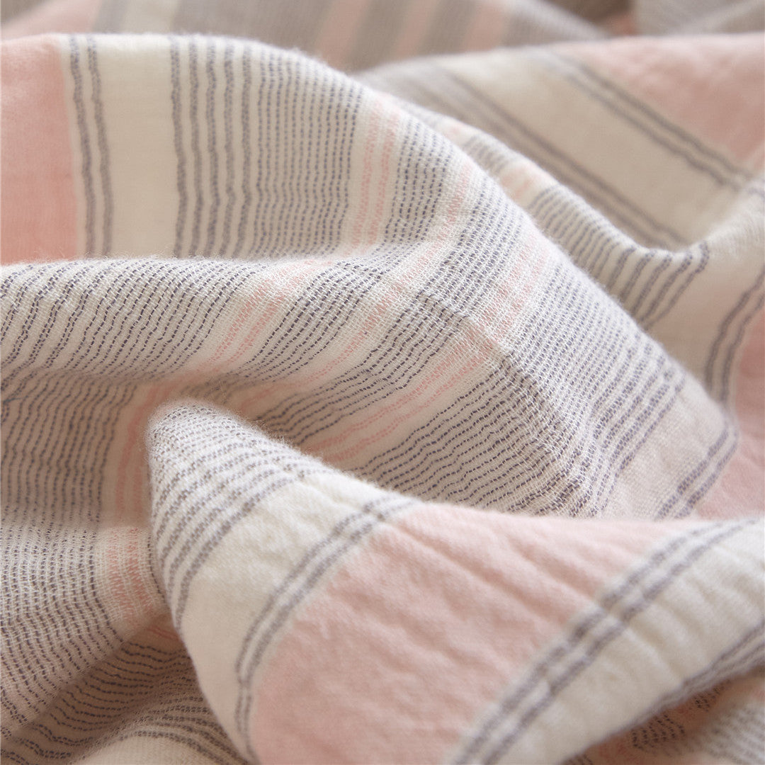 Detailed fabric close-up of the Grey & Pale Pink cotton gauze, emphasizing the yarn-dyed stripes and soft, breathable weave.