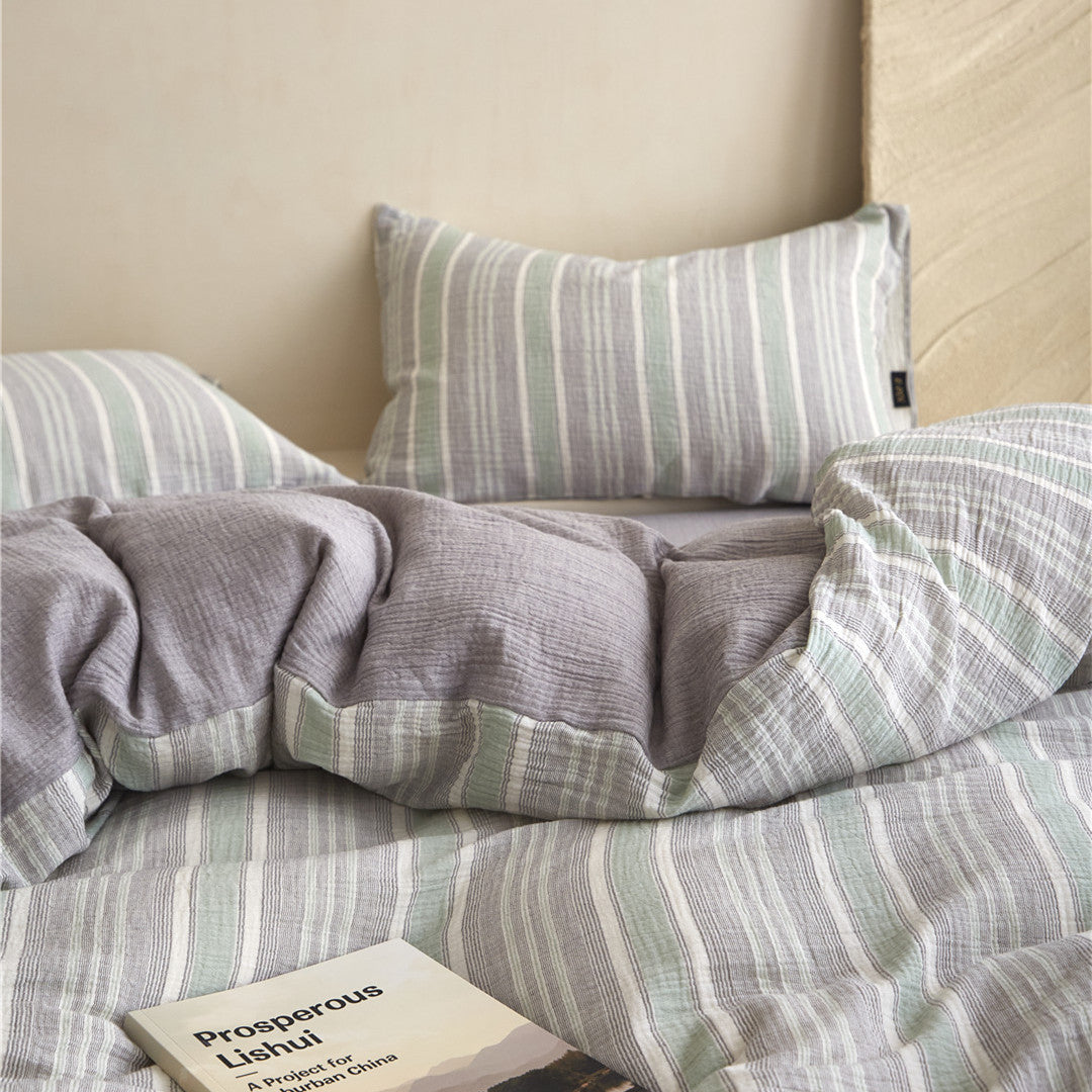 Close-up of the Grey & Pale Green duvet cover, showing the stripe and the solid reverse side (which matches the sheet).