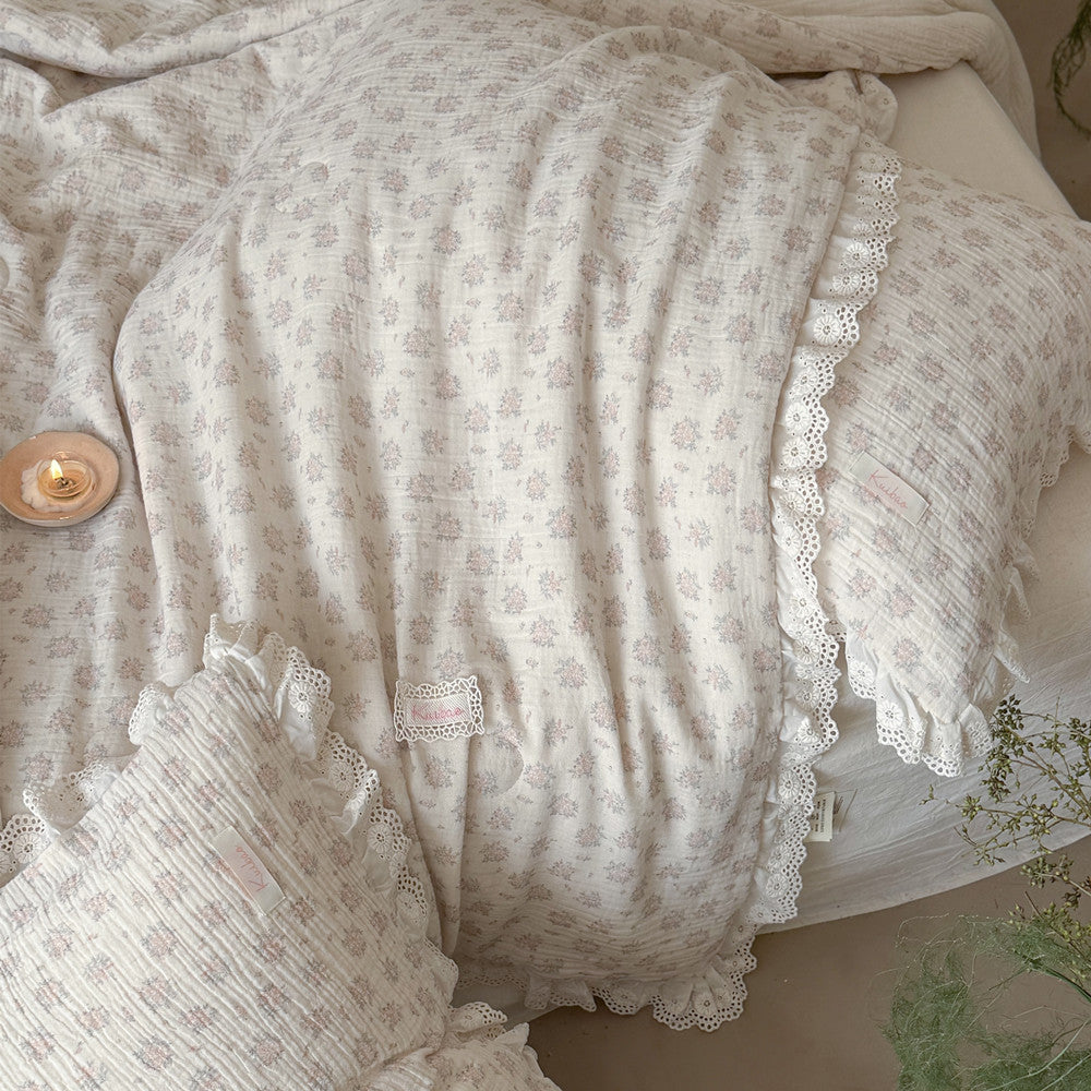 Floral-patterned fabric with lace trim on a textured surface