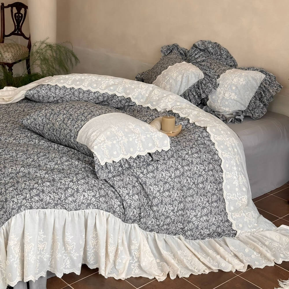 Gray botanical ruffle bedding set with ivory embroidery in a romantic cottage bedroom