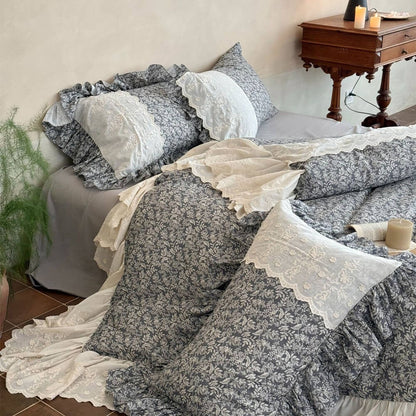 Cotton muslin botanical bedding with scalloped ivory embroidery and soft cottage styling