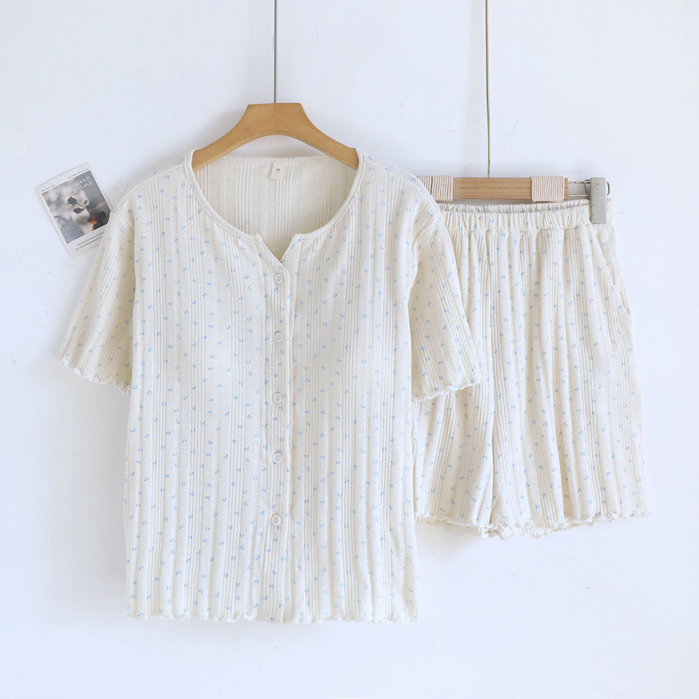 Cream cotton short sleeve pajama set with blue ditsy floral pattern on hanger