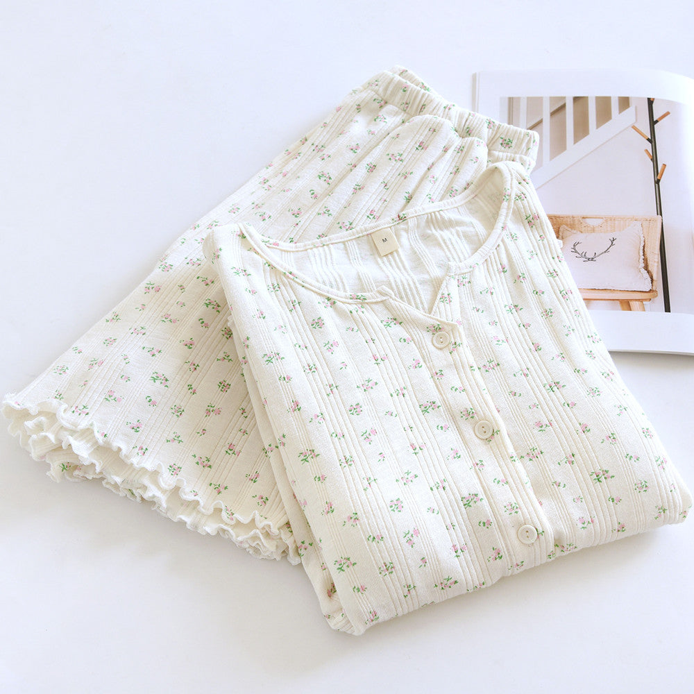 Cotton short sleeve pajama set with ditsy floral print and button front, folded on white background