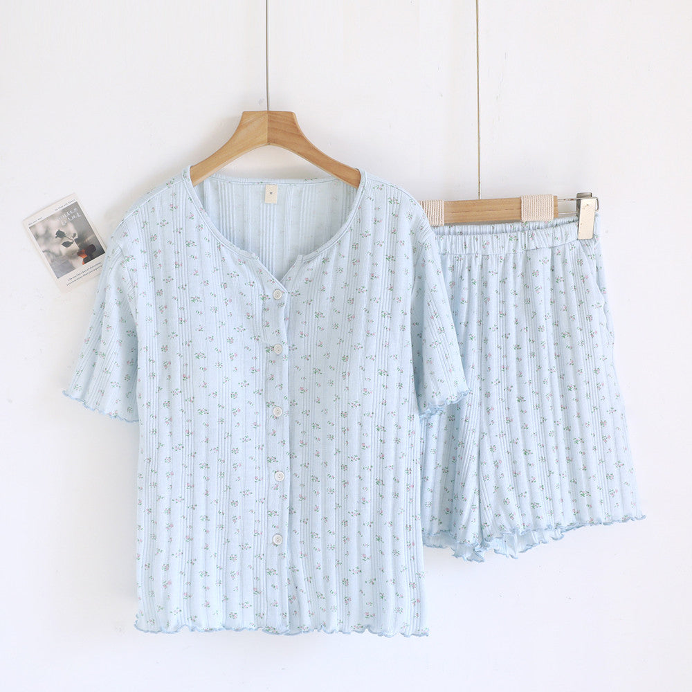 Light blue ditsy floral cotton short sleeve pajama set with button front and shorts.