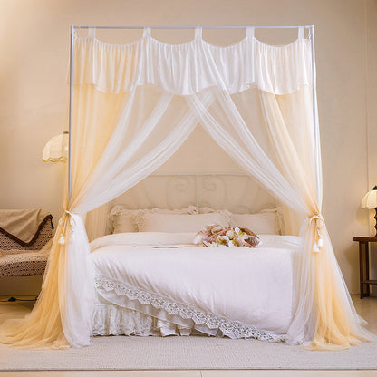 Elegant white canopy bed with sheer curtains and luxury cotton bedding in cozy bedroom