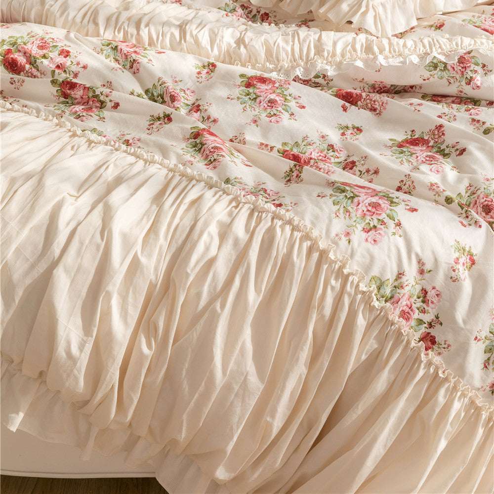 Floral cotton bedding set with ruffles and bed skirt in soft, romantic colors
