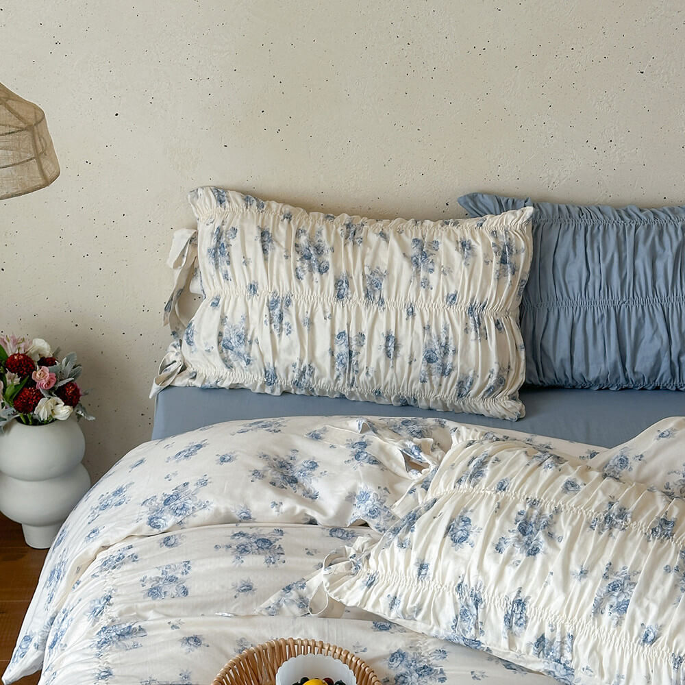 Vintage-inspired blue floral cotton bedding set with soft gathered construction