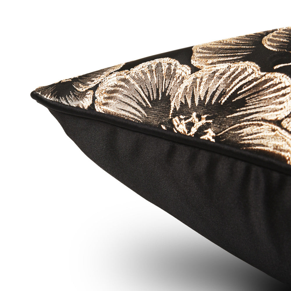 Gold floral decorative pillow cover on black fabric, luxury home decor accent