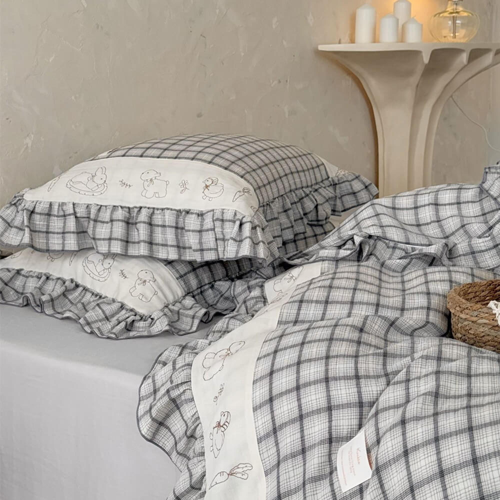 Grey plaid cotton muslin bedding set with ruffled trim and playful animal embroidery
