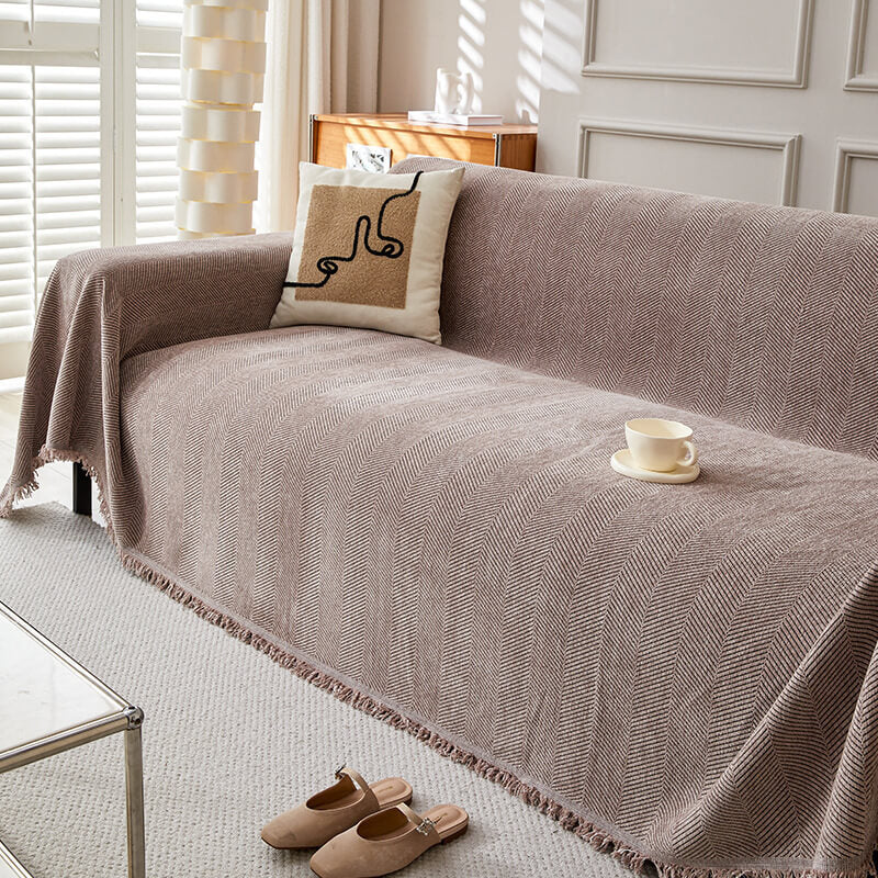 Herringbone chenille sofa cover in neutral living room with modern pillow and cup, StuffedHome bedding