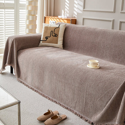 Herringbone chenille sofa cover in neutral living room with modern pillow and cup, StuffedHome bedding