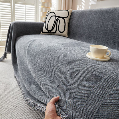 Gray herringbone chenille sofa cover in living room with abstract pillow and teacup, StuffedHome