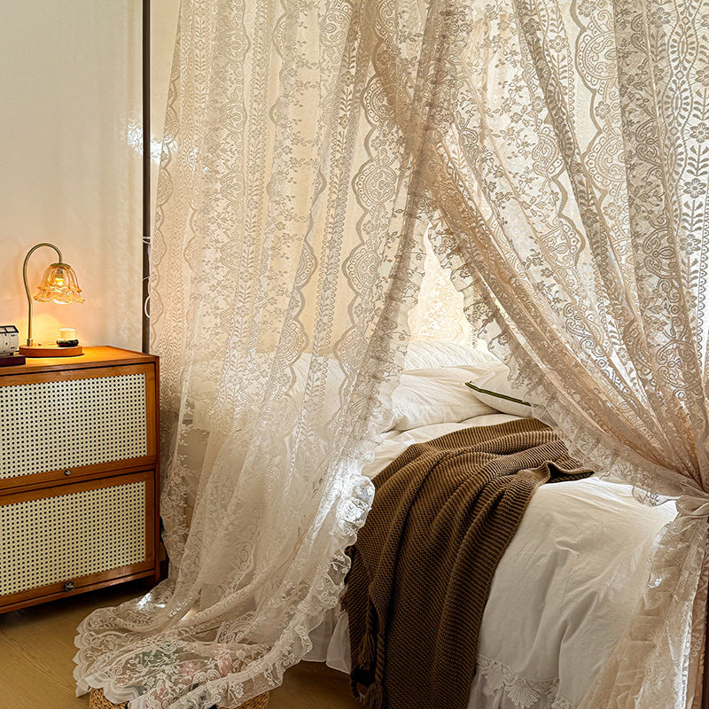 Romantic lace canopy curtains for four-poster bed with cozy bedding and bedside table
