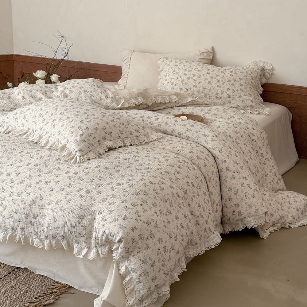 Cotton linen blue rose bedding set layered with matching pillowcases and lace ruffle edges