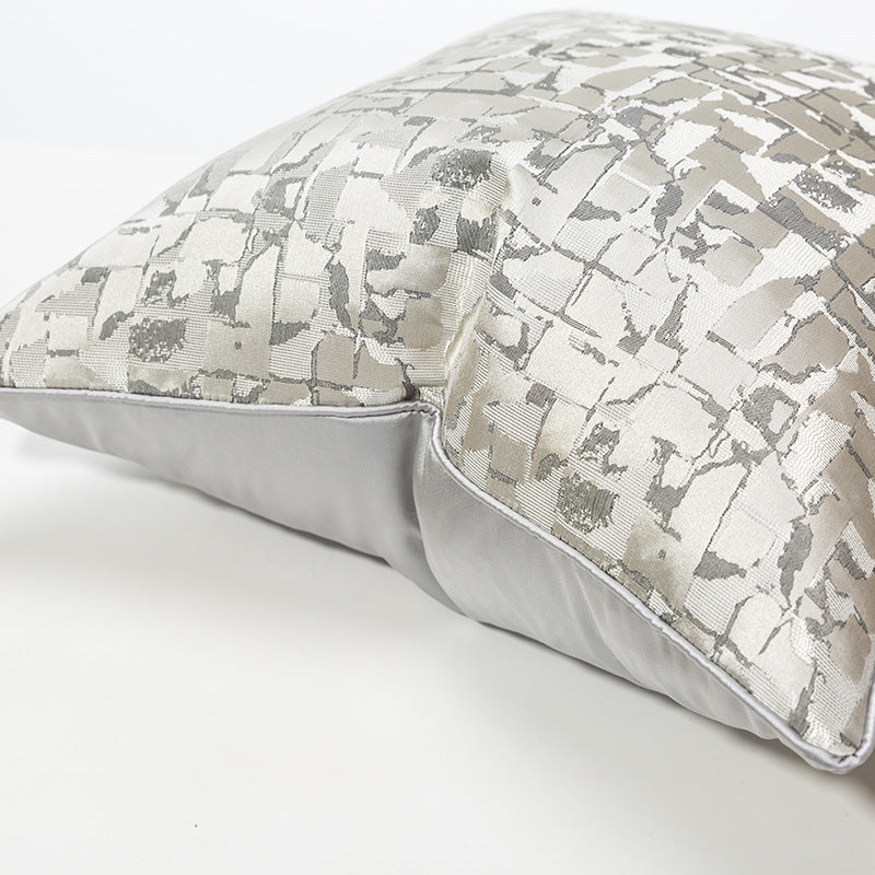 Modern metallic decorative pillow cover with abstract silver pattern on white background