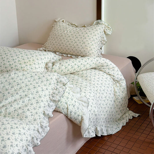 A styled bed with a Queen-size Muslin Duvet Cover Set, highlighting the soft, textured Cotton Gauze Bedding and ruffled edges.