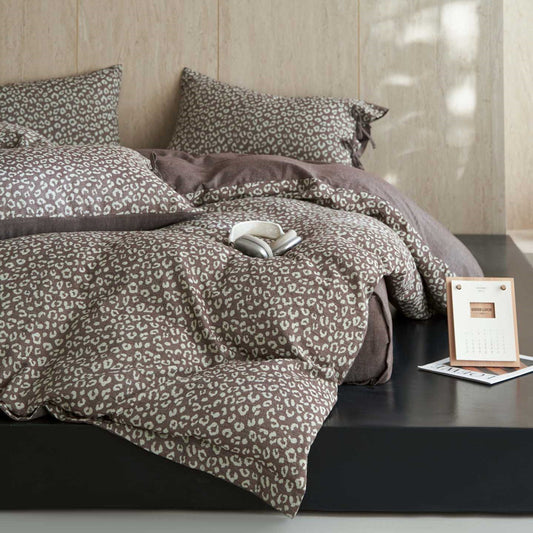 Neutral leopard print cotton gauze bedding set on a modern bed with pillows and soft comforter