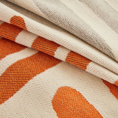 Reversible geometric sofa cover with orange and beige patterns, natural cotton fabric