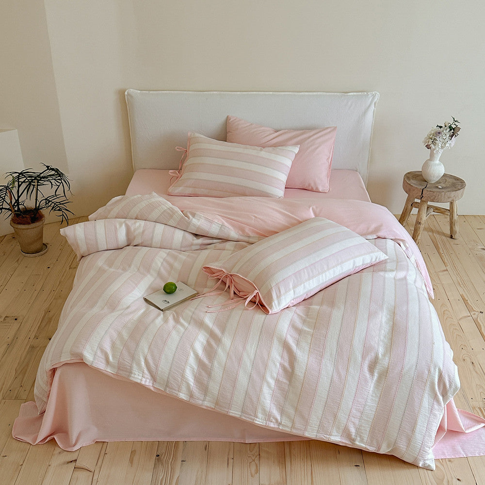 Top-down view of the pink Pastel Cotton Striped Bedding Set fully displayed, offering a cozy and fresh bedroom look.