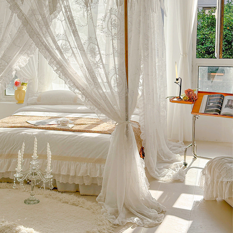 Elegant bedroom with white floral lace canopy curtains, cozy bedding, and natural sunlight.