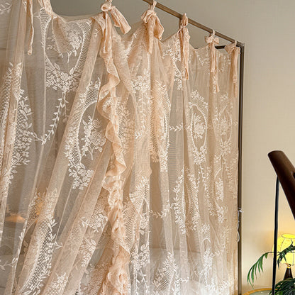 Romantic lace bed canopy curtains with floral patterns on a four-poster bed frame