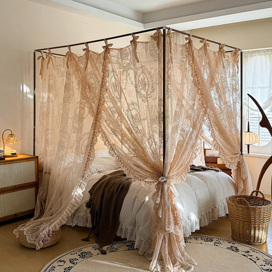 Romantic lace bed canopy curtains on a 4 poster bed in a cozy sunlit bedroom