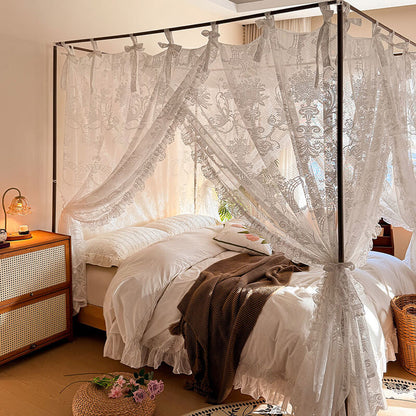 Romantic lace bed canopy with bow ties over a cozy bed in an elegant bedroom