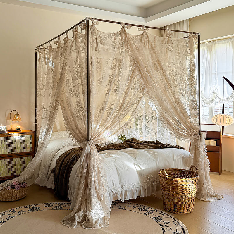 Bedroom with a canopy bed featuring lace curtains and decorative elements.