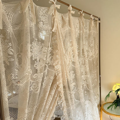 Lace curtain with intricate patterns in a room setting