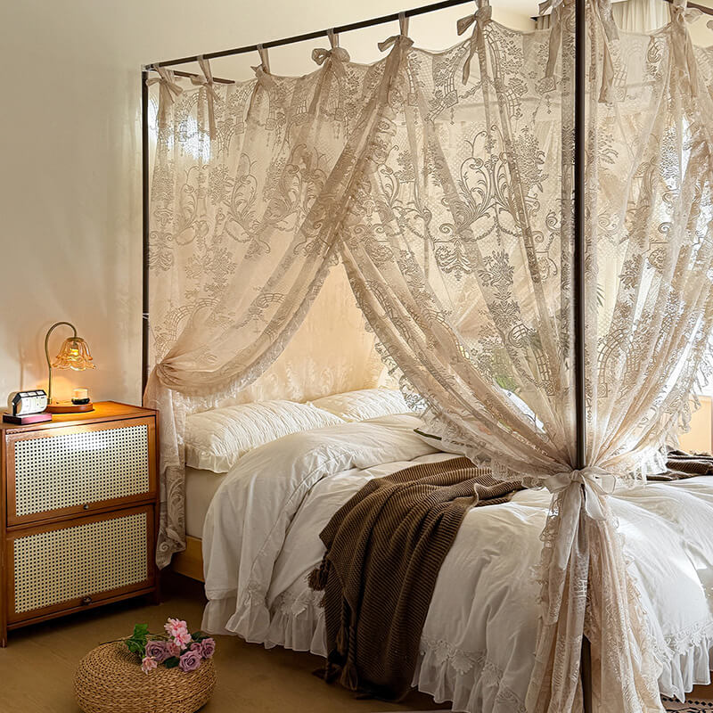 Bedroom with a canopy made of lace curtains, wooden nightstand, and decorative elements.