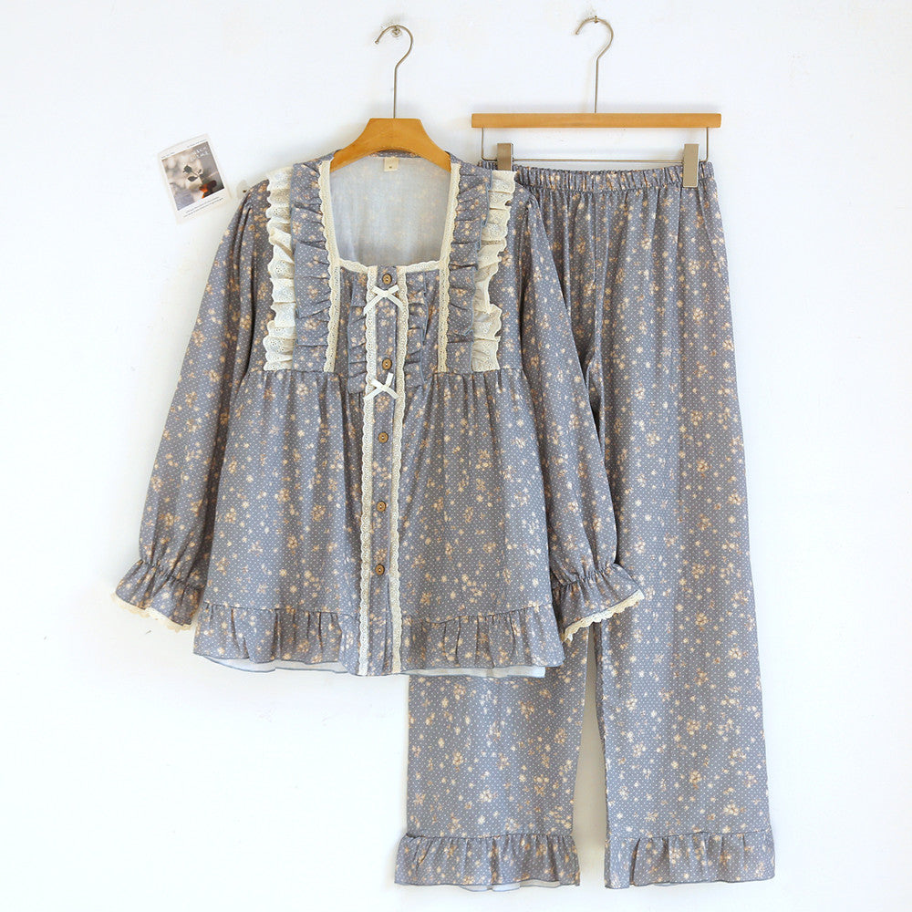 Blue cotton pajama set with lace ruffles, floral print, and button-up long sleeves