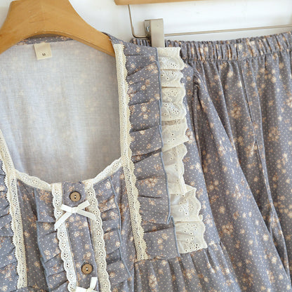 Blue floral cotton pajama set with lace trim and ruffle details on a hanger