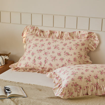 Soft pink floral cotton muslin ruffle pillow shams, charming bedding essential for a cozy, vintage-styled home