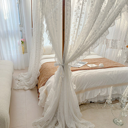 Sheer lace bed canopy over a cozy pure cotton bed in a bright, elegant bedroom decor