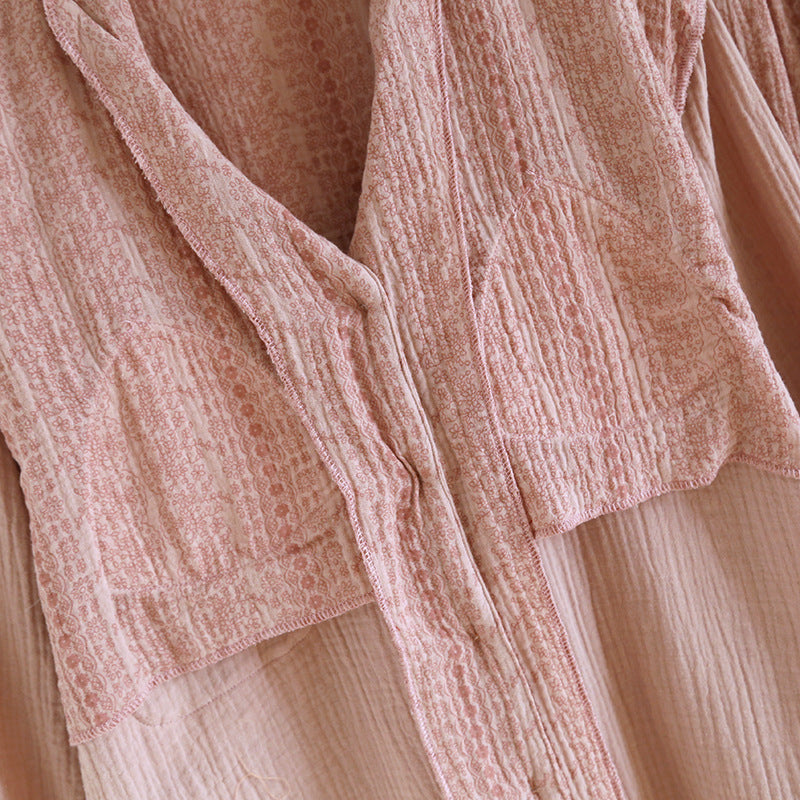 Soft pink cotton gauze pajama top with delicate textured pattern and button details