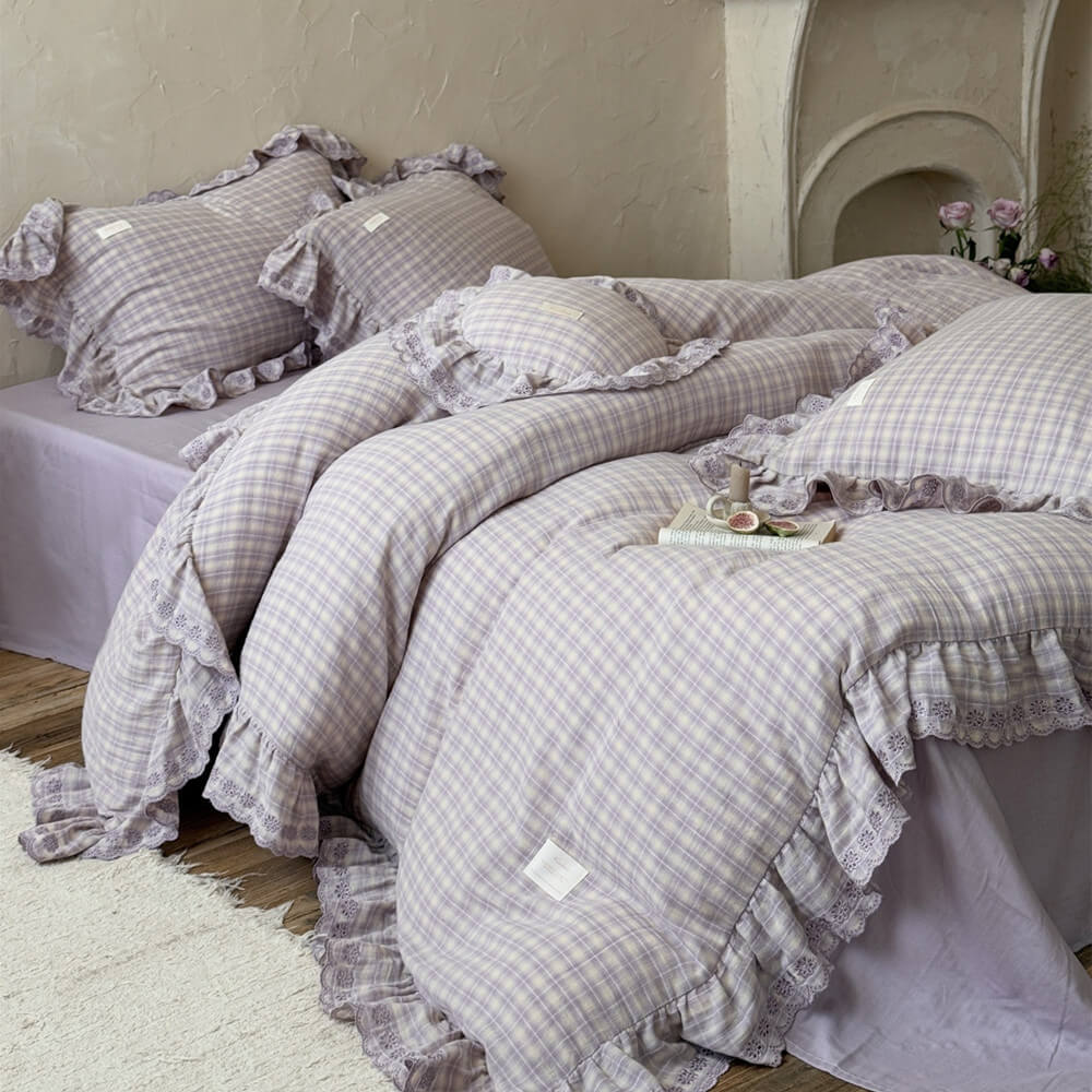 Cozy lavender plaid ruffled duvet cover set with decorative pillows, featuring cotton muslin and ruffle trim