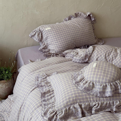 Close-up of ruffled pillow and duvet cover from lavender plaid cotton muslin duvet set