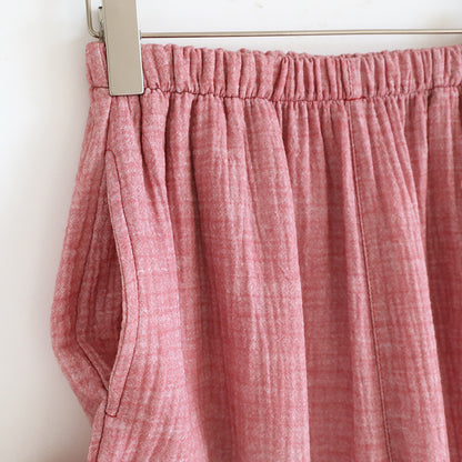 Soft pink cotton gauze pajama pants with elastic waistband and side pocket detail