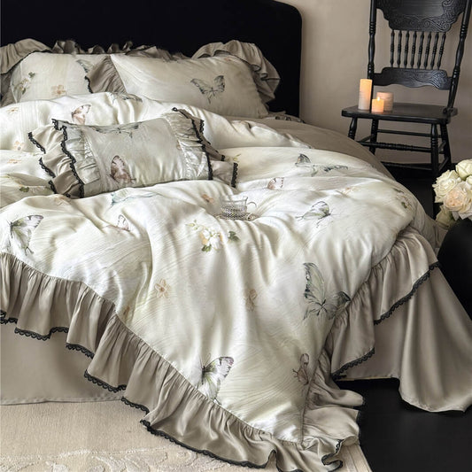 Detailed side view of the Soft TENCEL™ Butterfly Duvet Cover, showcasing the layered ruffles, butterfly print, and matching decorative pillows