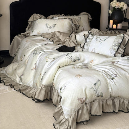 Wider angle view of the Soft TENCEL™ Butterfly Duvet Cover Set, illustrating the romantic drape and the overall plush appearance of the bedding.
