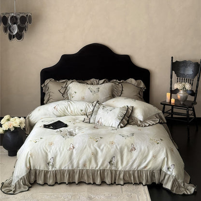 Full bedroom scene featuring the Soft TENCEL™ Butterfly Duvet Cover Set, with a dark chandelier and antique-style chair for scale and mood.