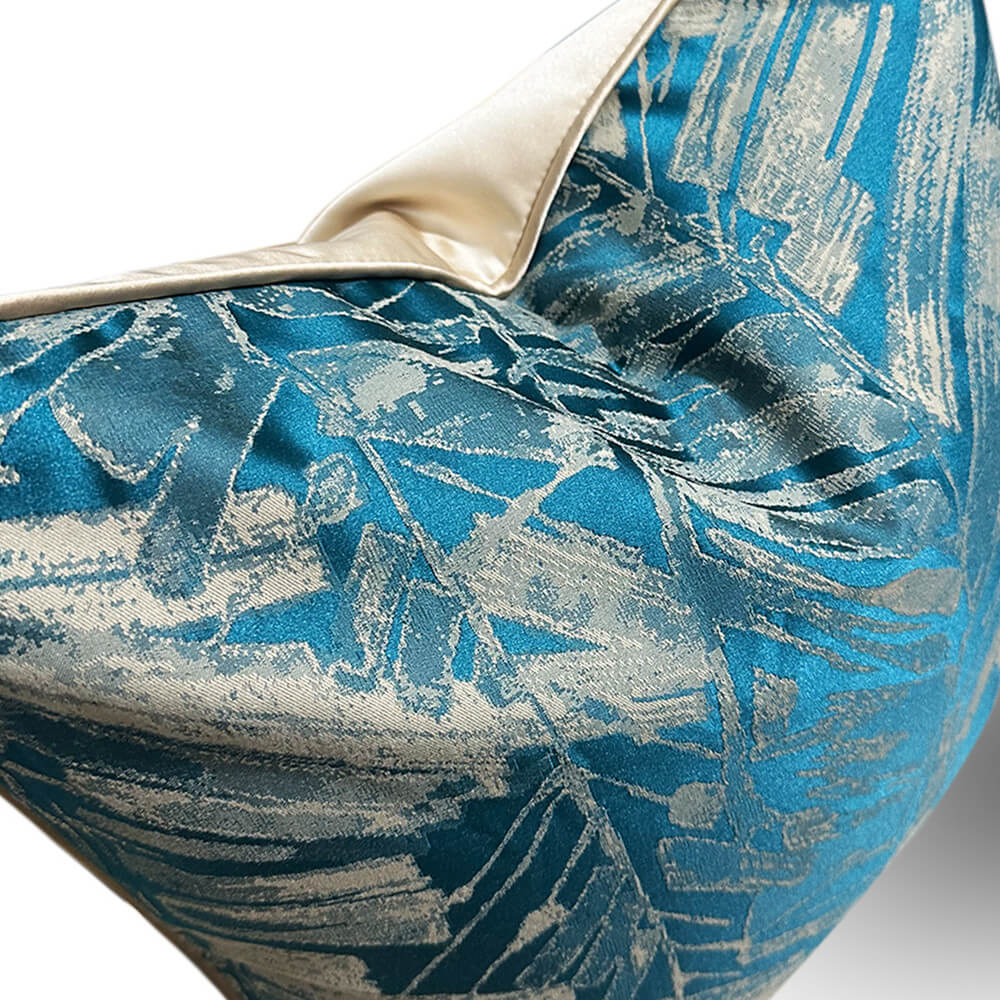 Soft teal geometric textured decorative pillow cover with cream trim from StuffedHome