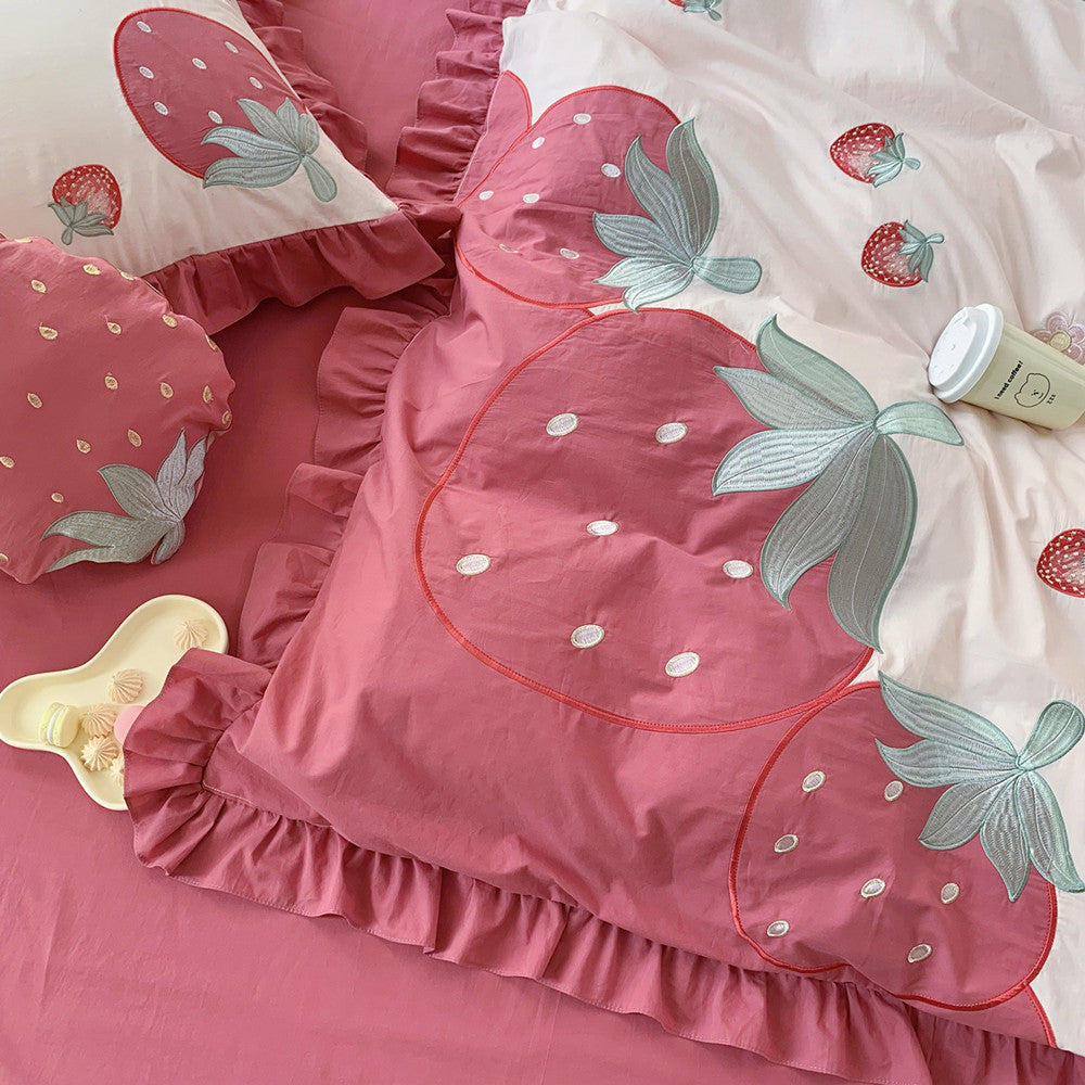 Pink strawberry cotton bedding set with ruffled edges on StuffedHome