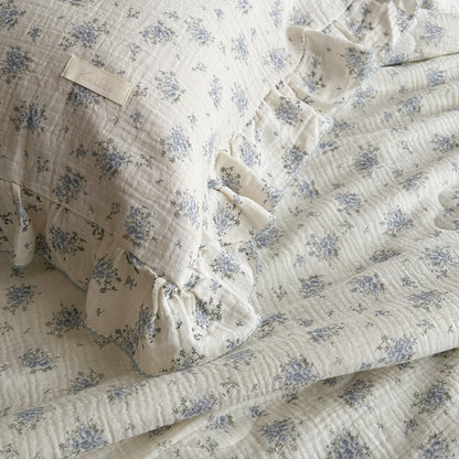 Floral cotton comforter and pillow with double ruffle detail