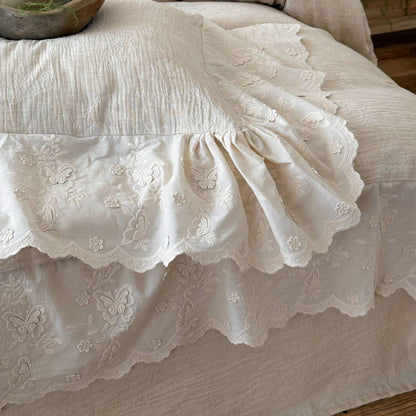 Cream textured linen cotton bedding set with embroidered floral and butterfly trim
