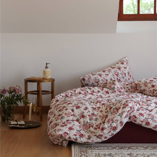 Vintage Rose Knit Cotton Bedding Set styled in a cozy bedroom, featuring floral duvet cover and bedside decor.