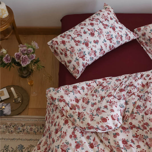 Overhead view of the Rose Knit Cotton Bedding Set, showcasing the deep red contrasting fitted sheet color.